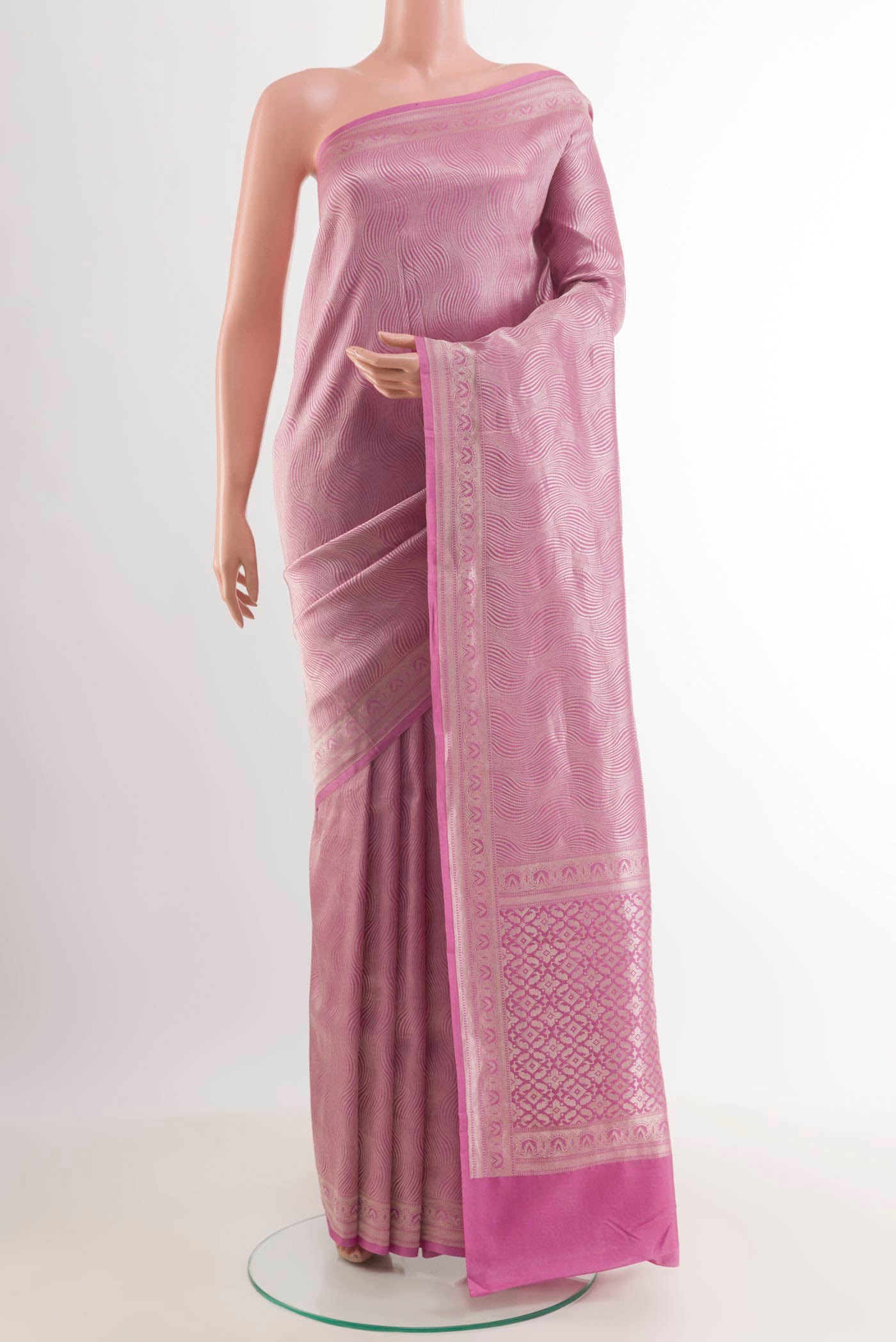 Dark Pink Crepe Saree with Zari Brocade on the body and Zari Border.  displayed on a mannequin