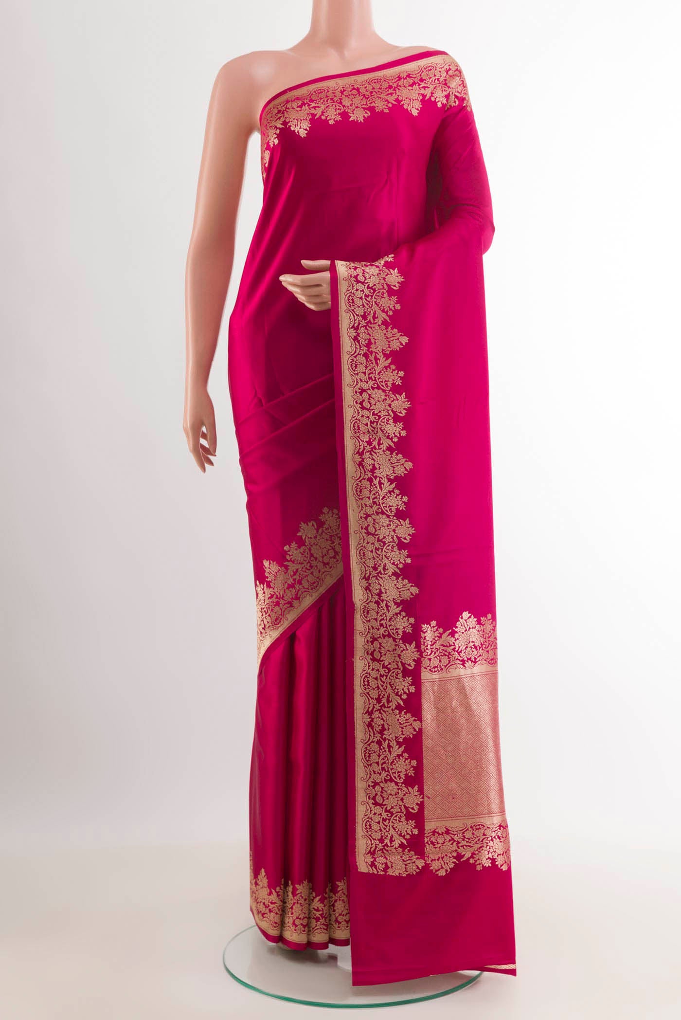 Rani Pink Banarasi Silk Saree with Plain Body and Zari Border.  displayed on a mannequin