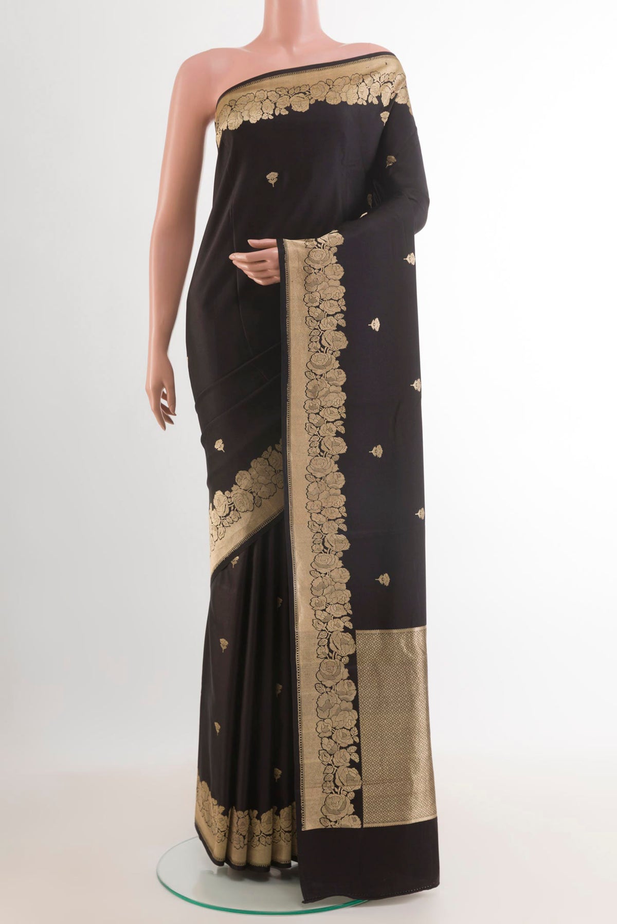 Black Banarasi Silk Saree with Zari Butta on the body and Zari Border.  displayed on a mannequin
