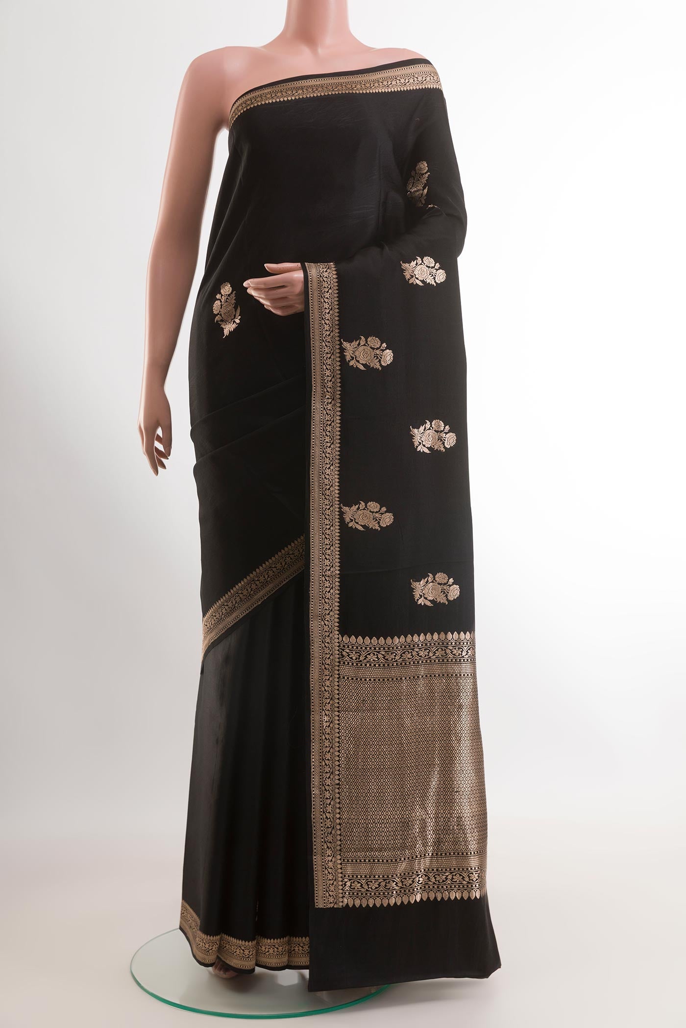 Black Banarasi Silk Saree with Zari Butta on the body and Zari Border.  displayed on a mannequin