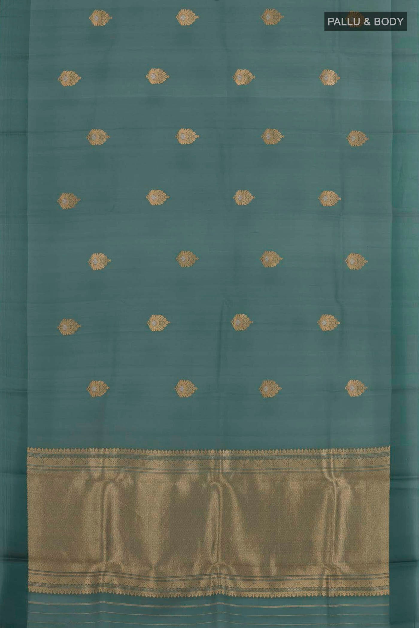 Flat view of Bottle Green Banarasi Kora Silk Saree with Zari Butta on the body and Zari Border. 