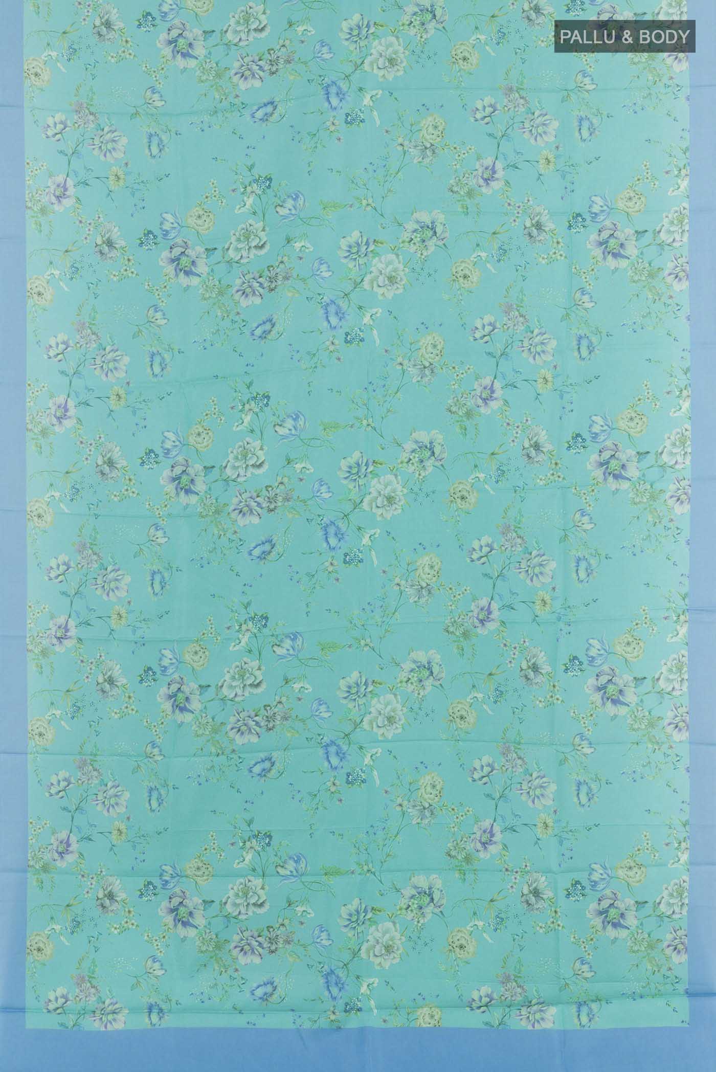 Flat view of Blue Printed Silk Saree with Printed design on the body and Plain Border. 