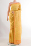 Yellow Printed Silk Saree with Printed design on the body and Printed Border.  displayed on a mannequin