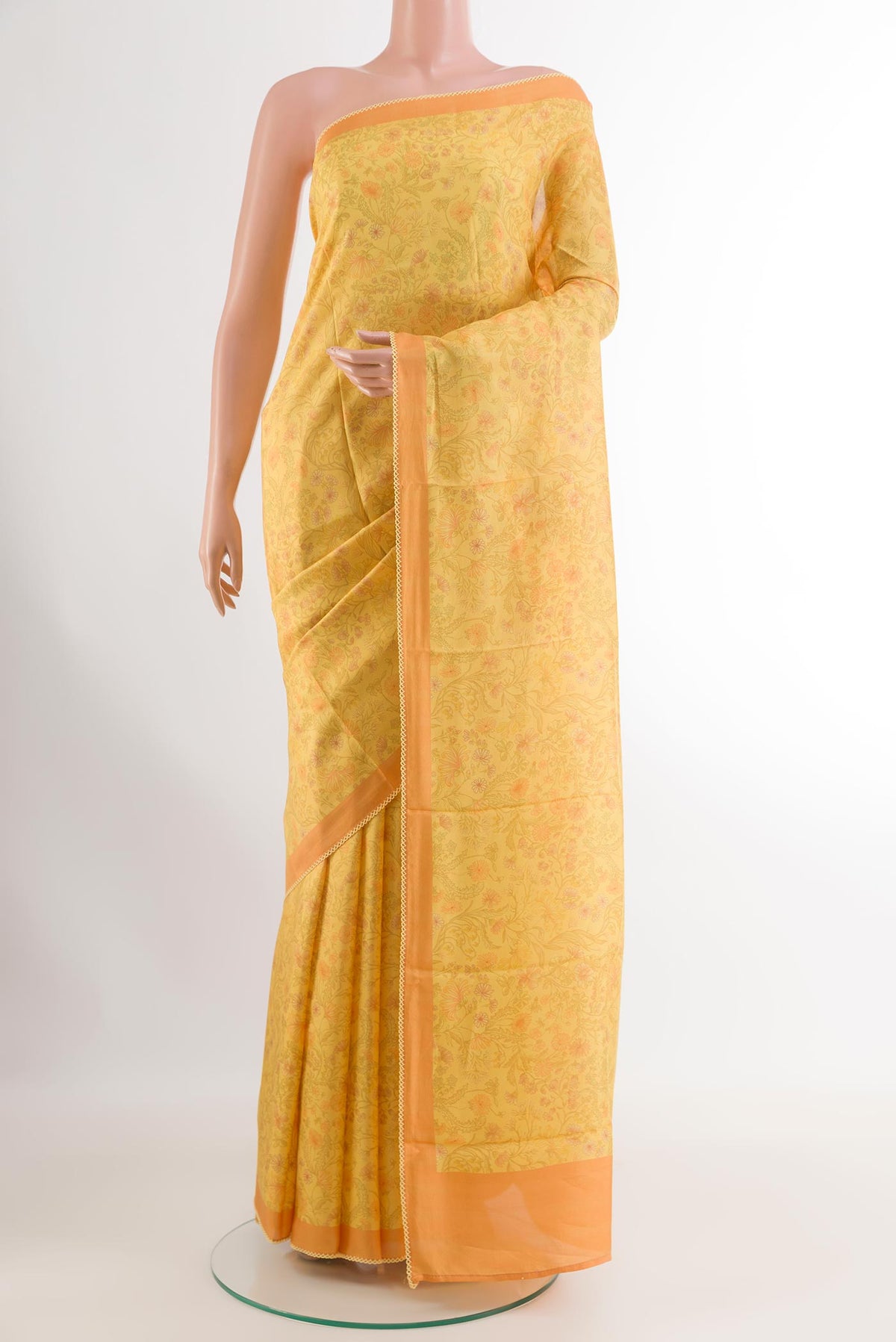 Yellow Printed Silk Saree with Printed design on the body and Printed Border.  displayed on a mannequin