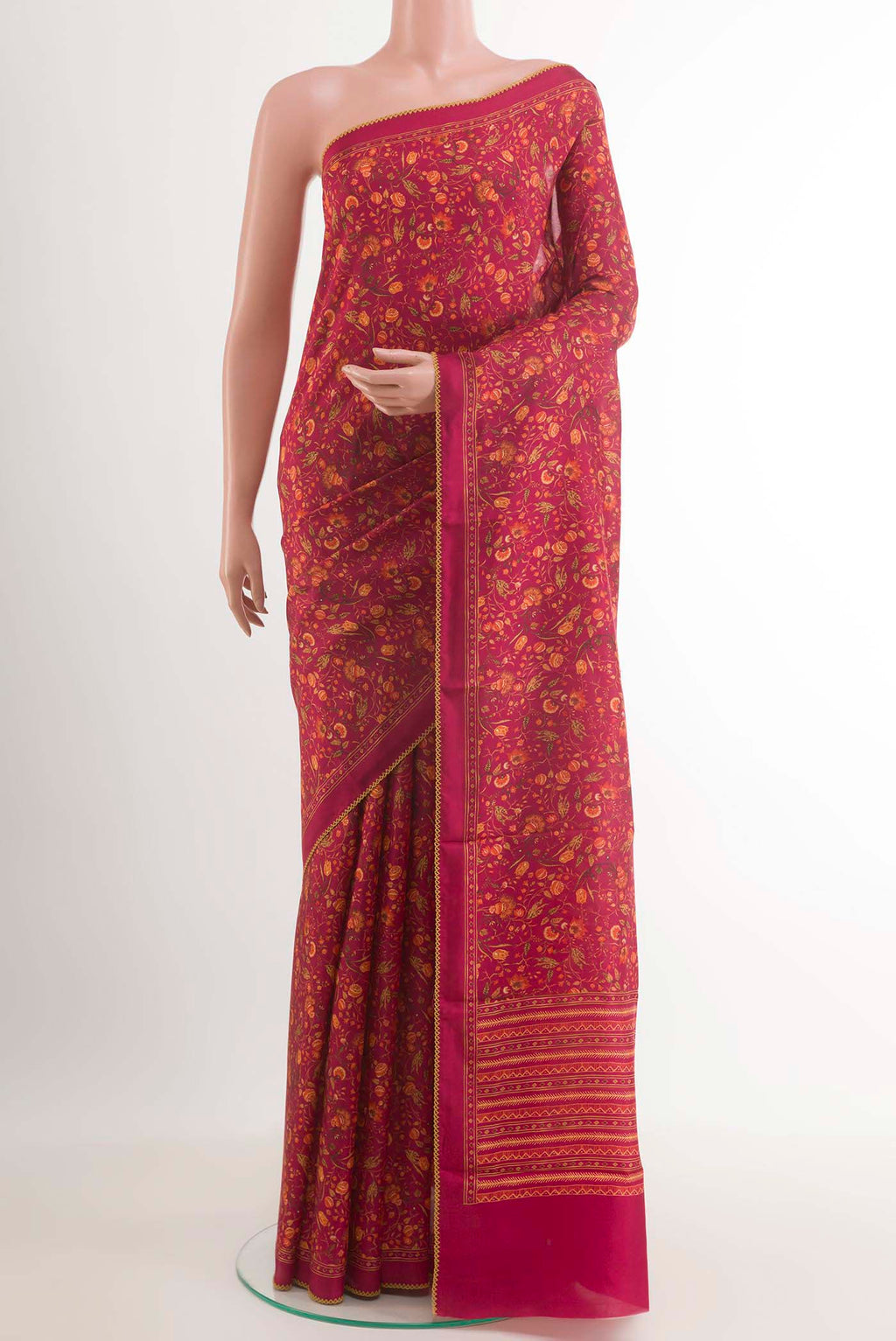 Pink Printed Silk Saree with Printed design on the body and Plain Border.  displayed on a mannequin