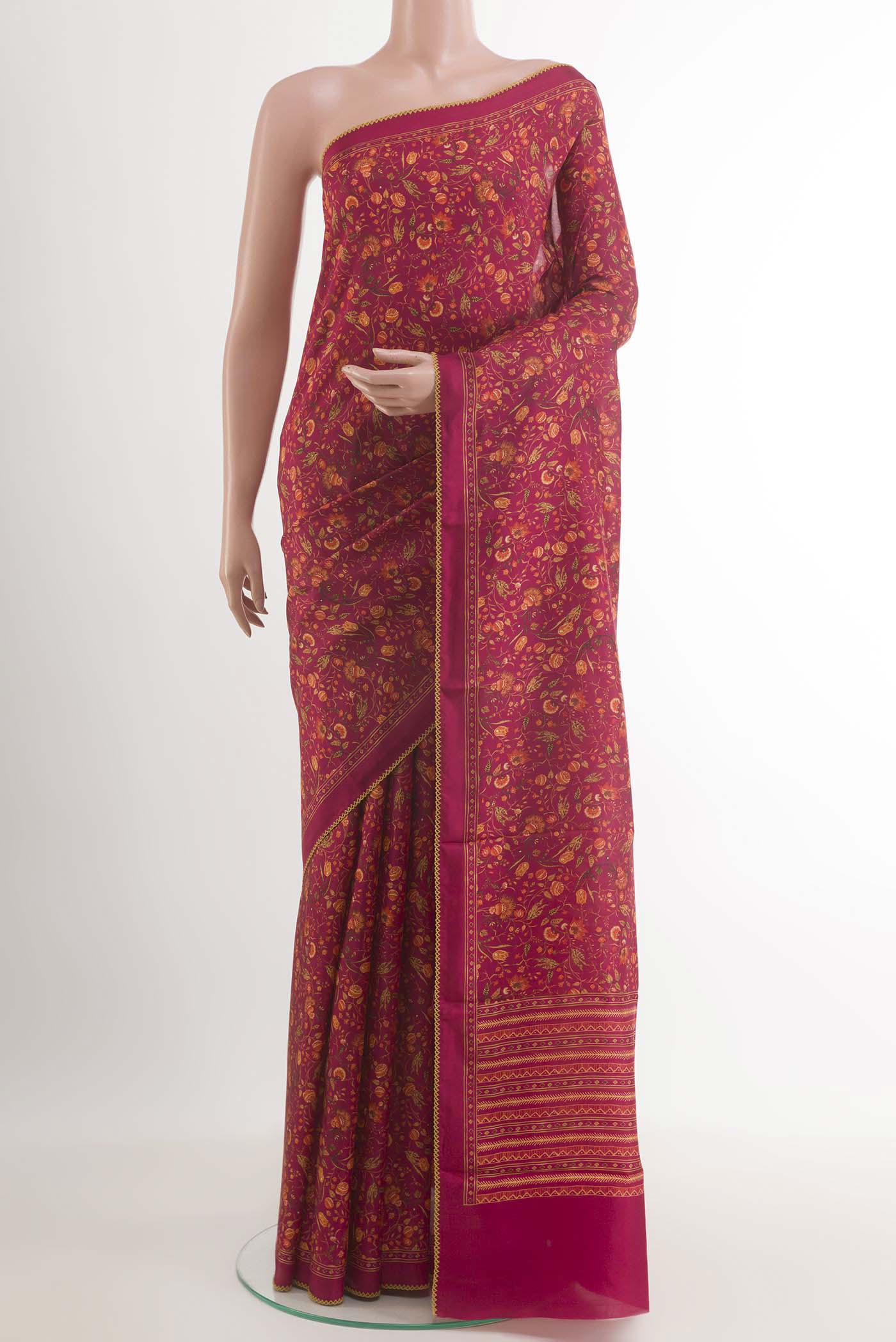 Pink Printed Silk Saree with Printed design on the body and Plain Border.  displayed on a mannequin