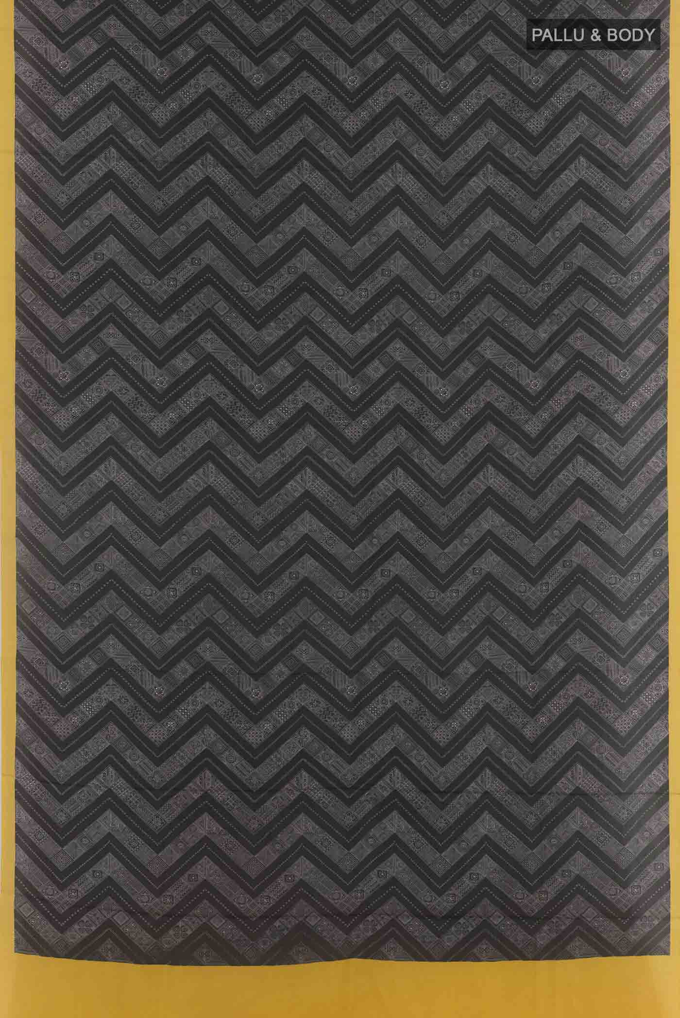 Flat view of Black Printed Silk Saree with Printed design on the body and Plain Border. 