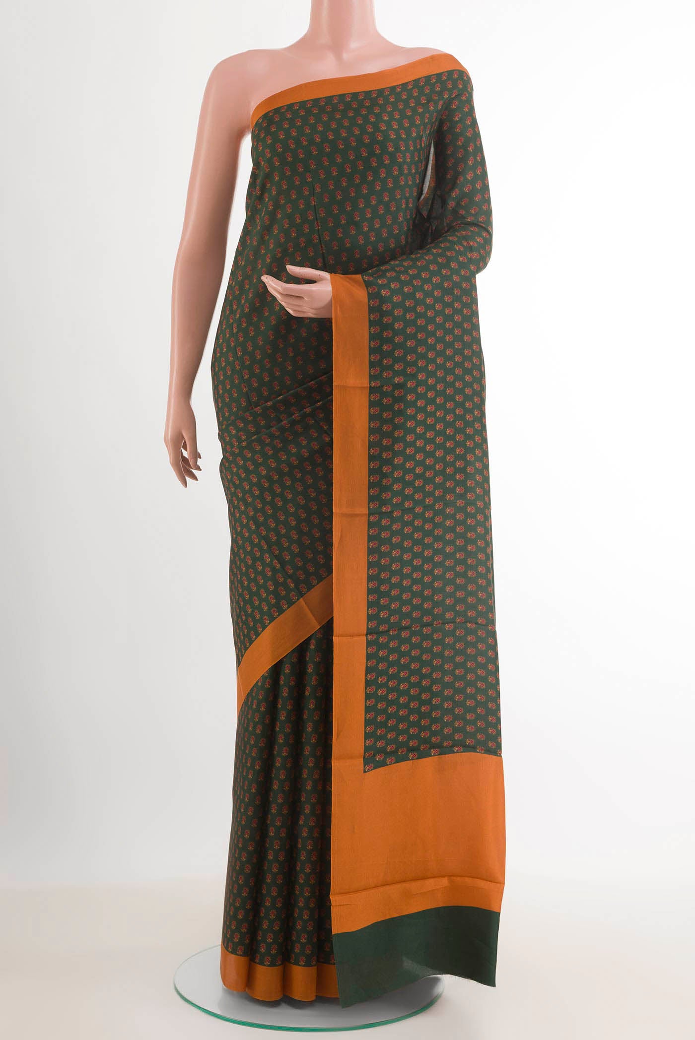 Bottle Green Printed Silk Saree with Printed design on the body and Plain Border.  displayed on a mannequin