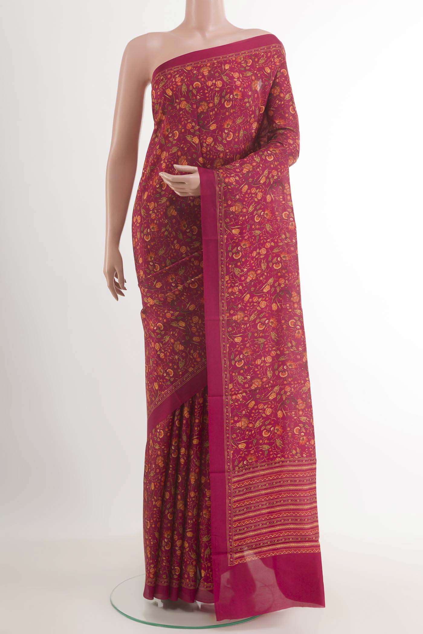 Pink Printed Silk Saree with Printed design on the body and Plain Border.  displayed on a mannequin