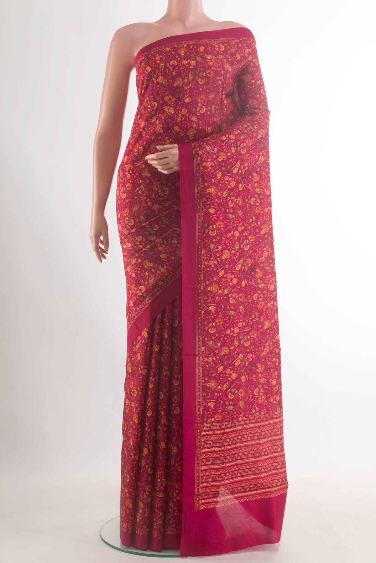 Pure Silk Red Printed Saree with Printed design on the body and Plain Border.  displayed on a mannequin