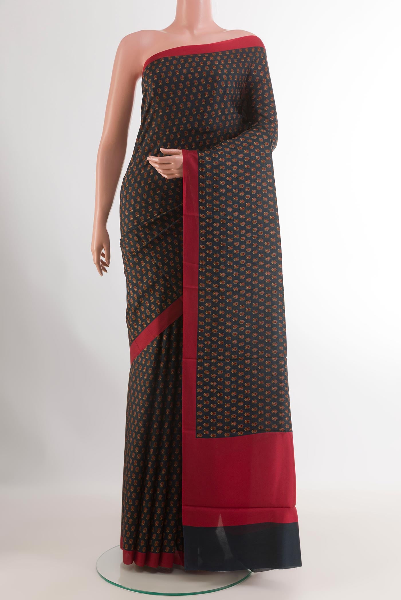 Blue Printed Silk Saree with Printed design on the body and Printed Border.  displayed on a mannequin