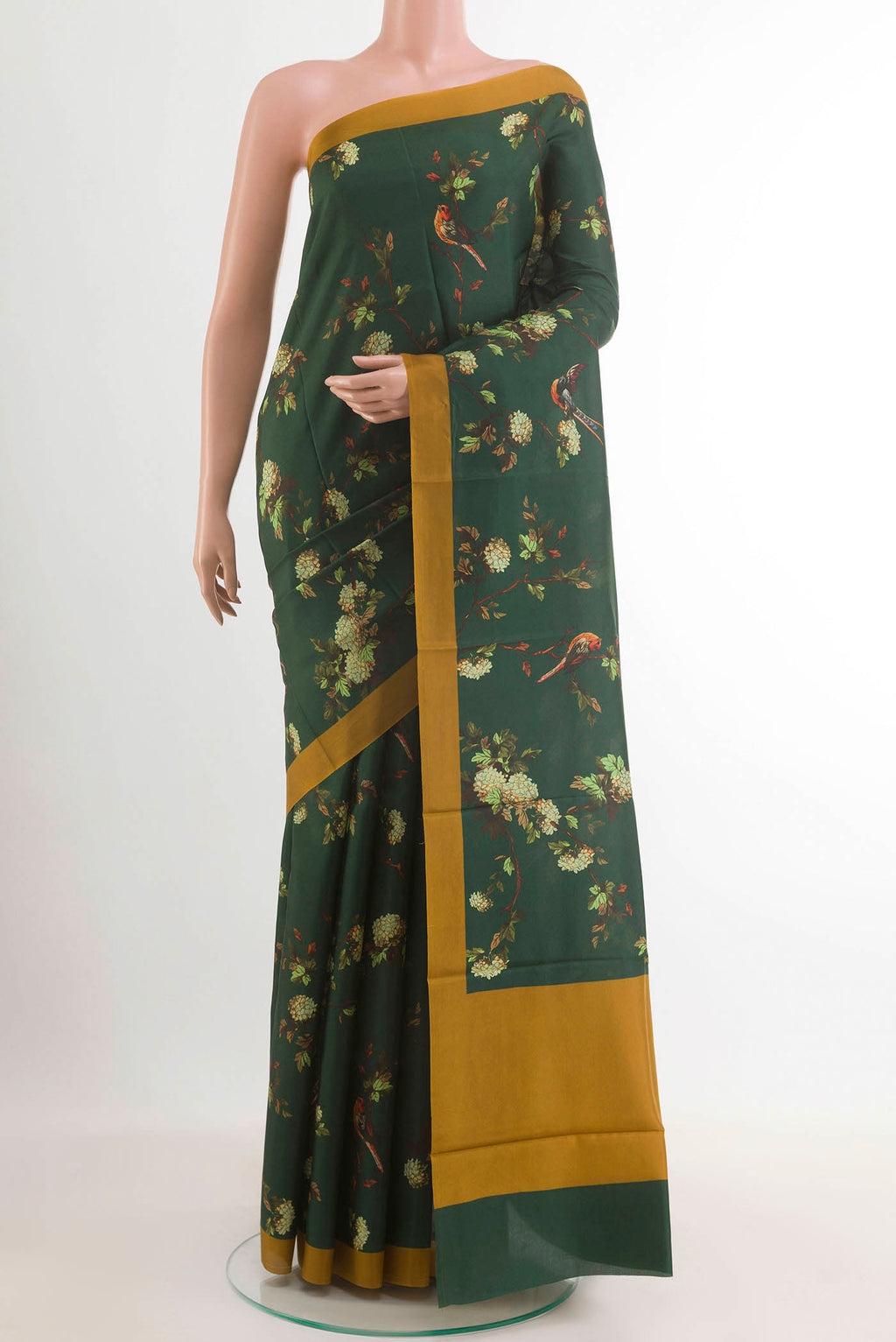 Bottle Green Printed Silk Saree with Printed design on the body and Plain Border.  displayed on a mannequin