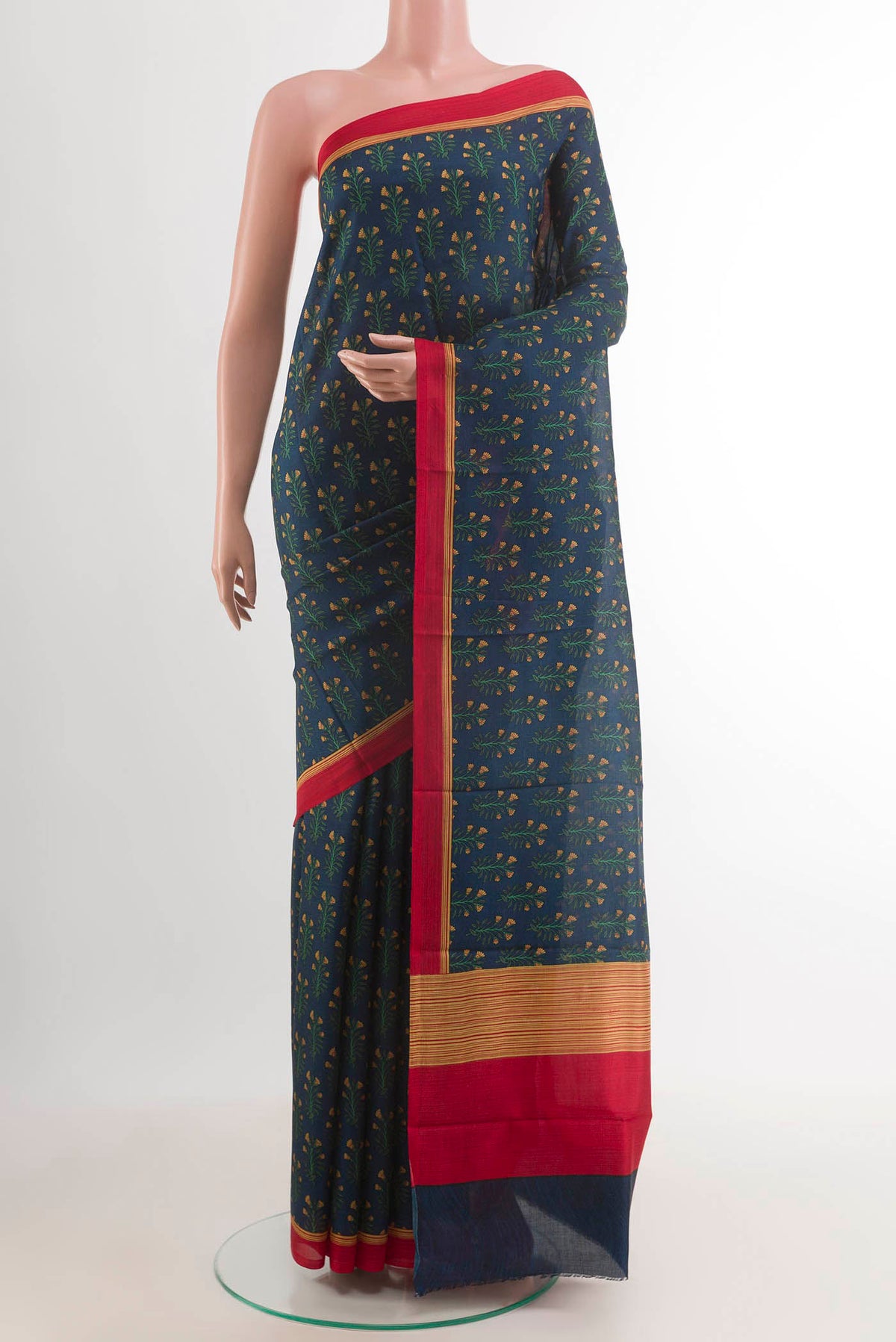 Blue Printed Silk Saree with Printed design on the body and Printed Border.  displayed on a mannequin