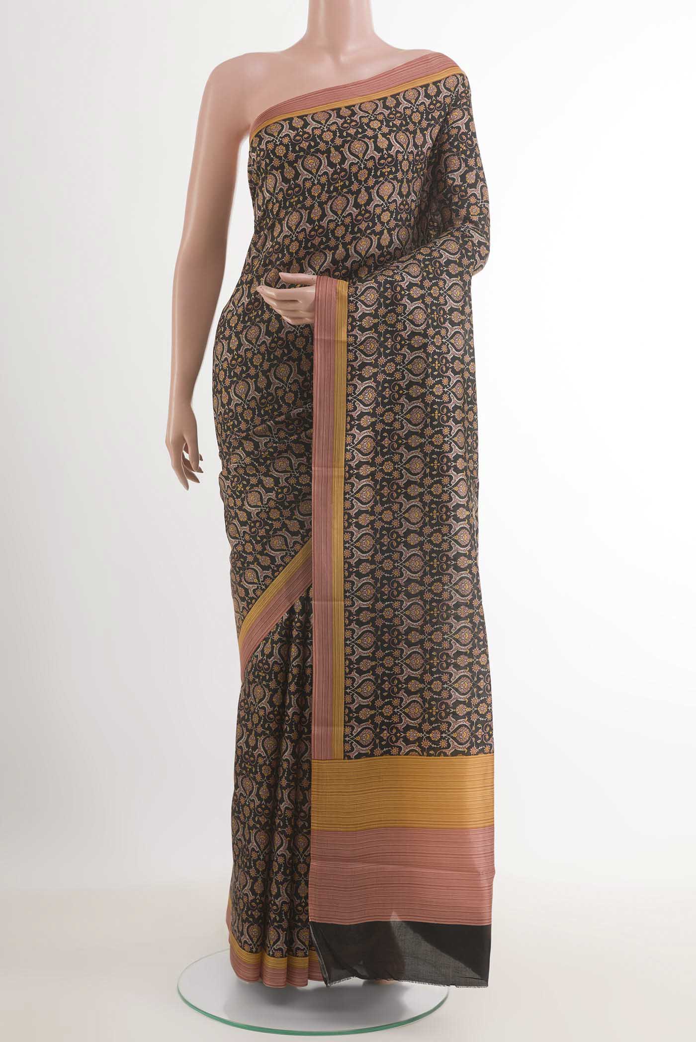 Black Printed Silk Saree with Printed design on the body and Printed Border.  displayed on a mannequin