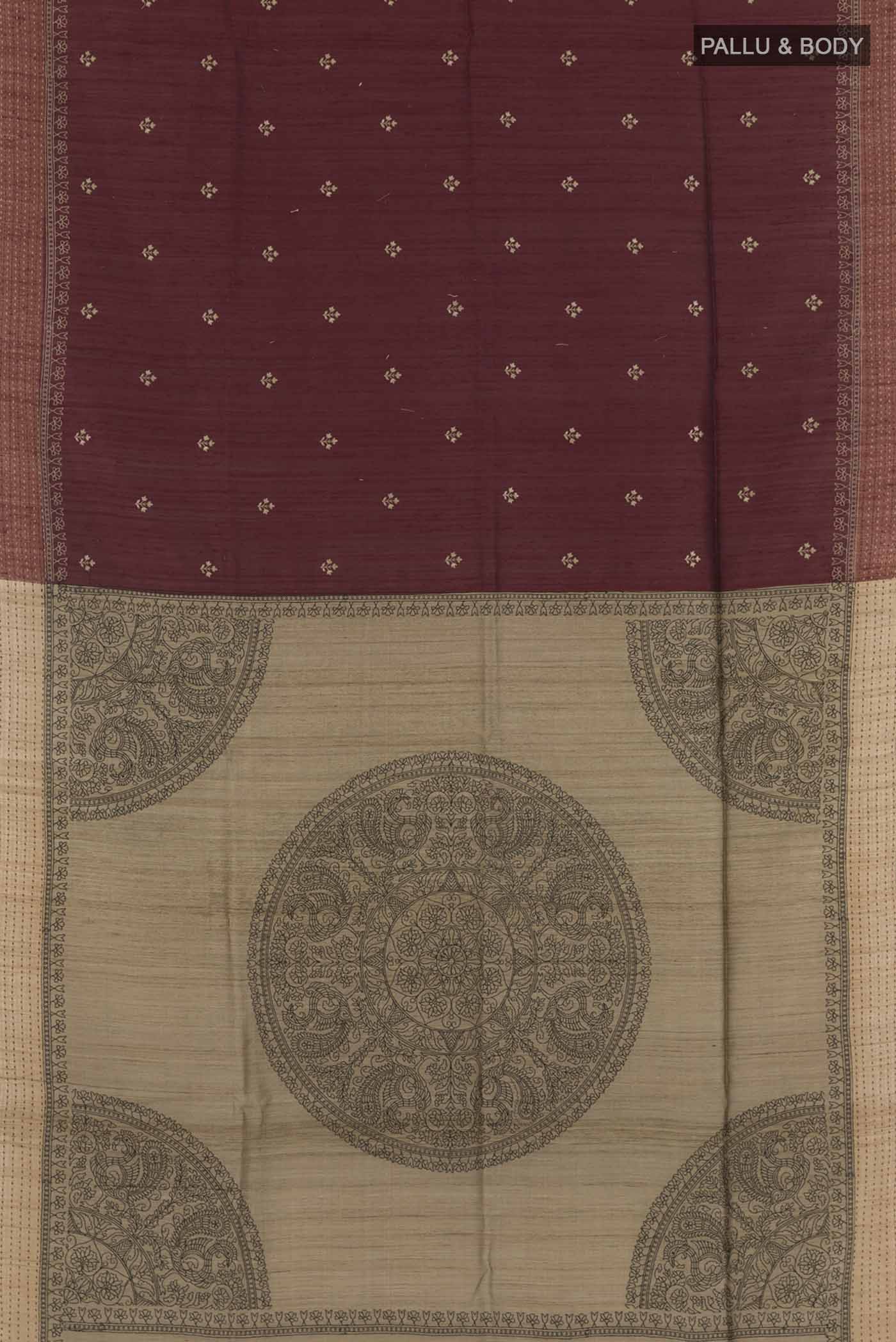Flat view of Maroon Tussar Saree with Thread Butta on the body and Zari Border. 