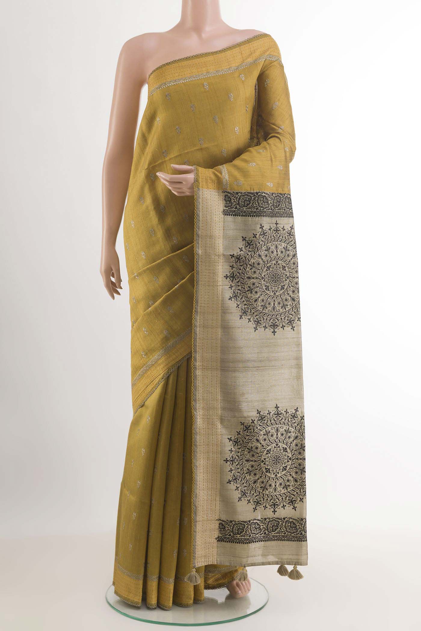 Yellow Tussar Saree with Thread Butta on the body and Thread Border.  displayed on a mannequin