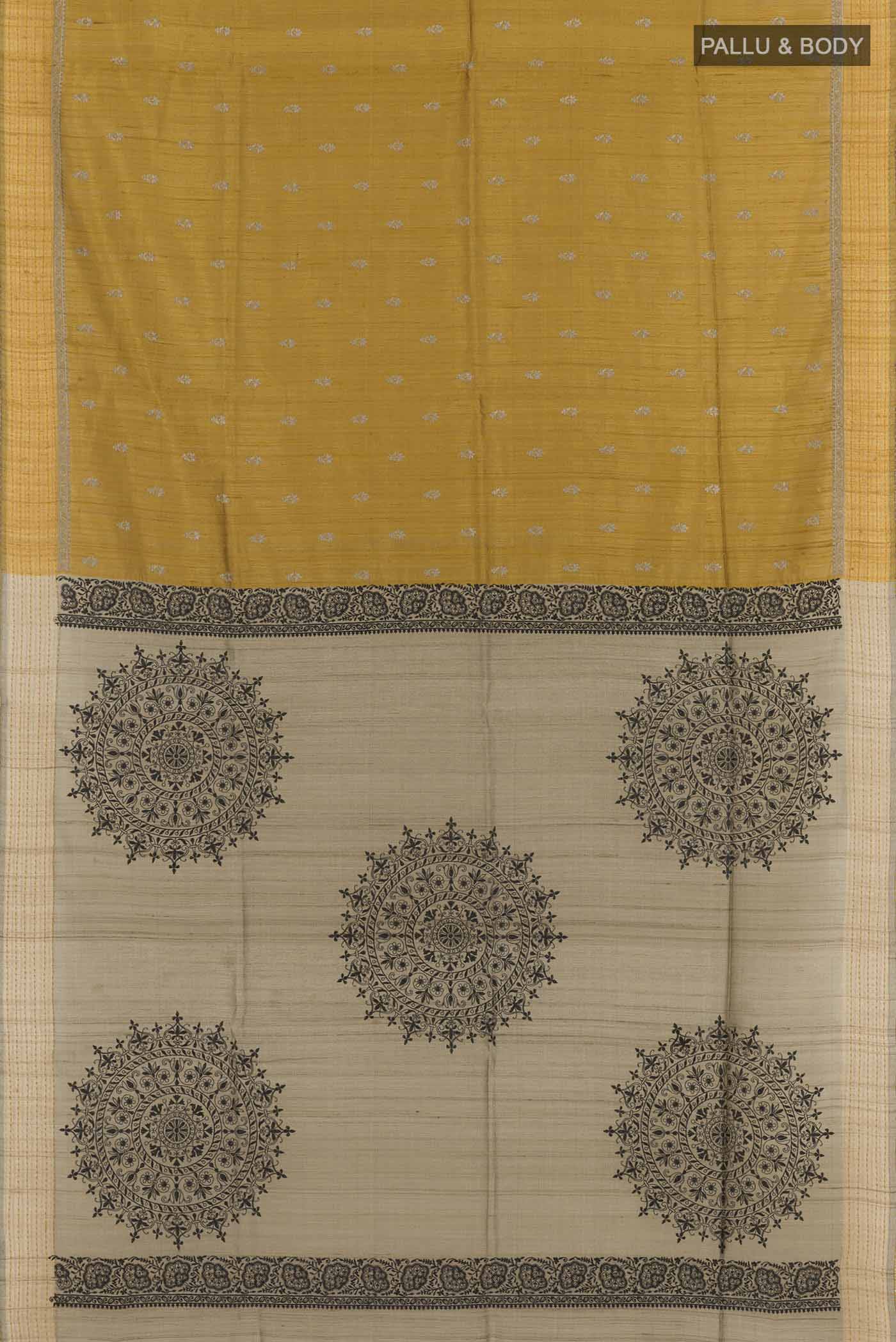 Flat view of Yellow Tussar Saree with Thread Butta on the body and Thread Border. 