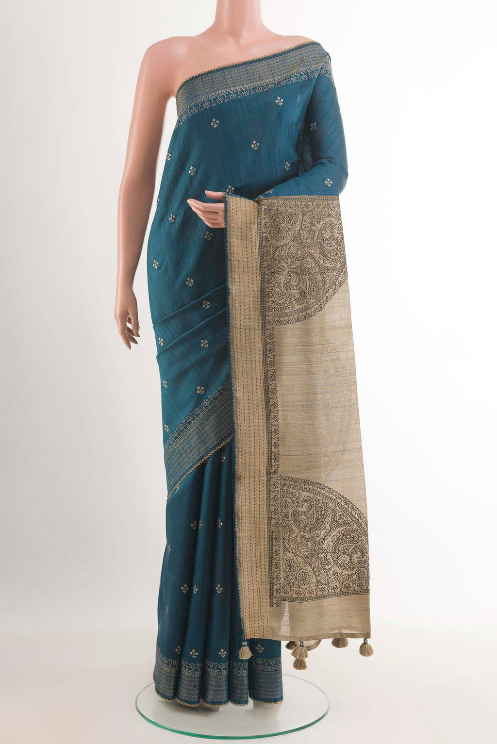 Blue Tussar Saree with Thread Butta on the body and Temple Border.  displayed on a mannequin