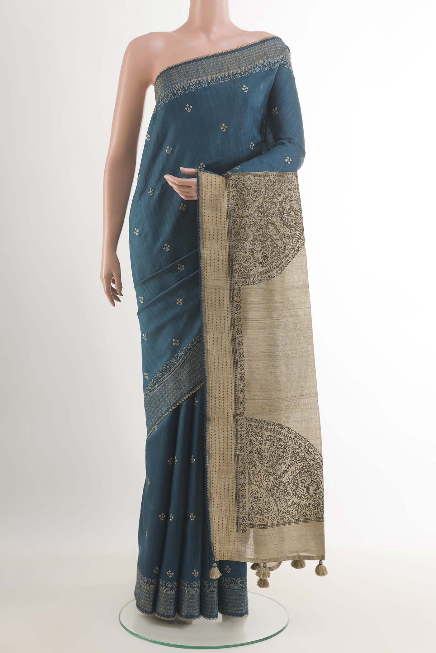 Blue Tussar Saree with Thread Butta on the body and Temple Border.  displayed on a mannequin