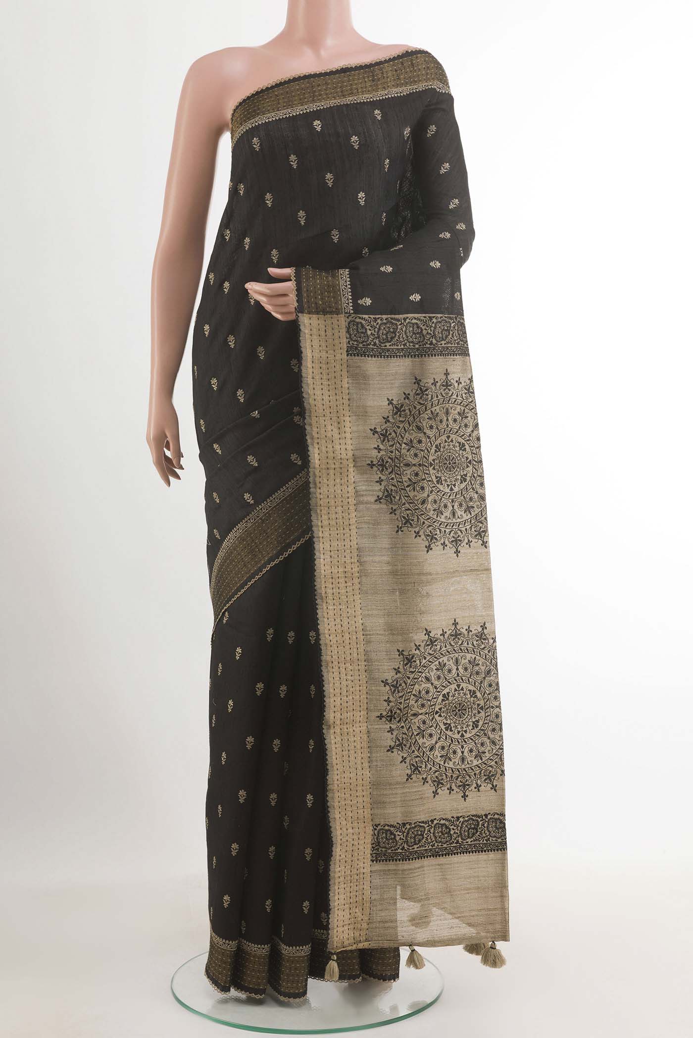 Black Tussar Saree with Thread Butta on the body and Zari Border.  displayed on a mannequin