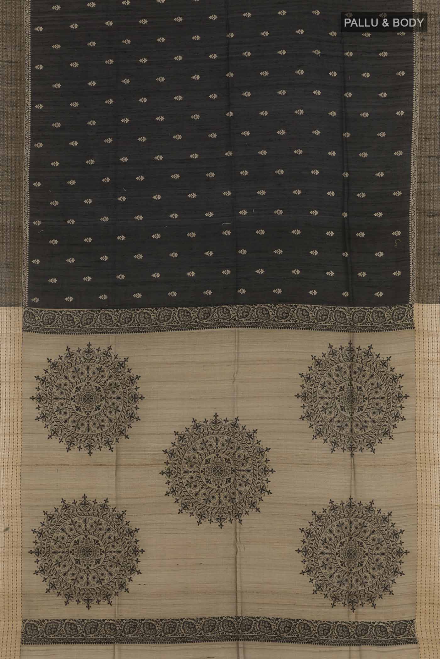 Flat view of Black Tussar Saree with Thread Butta on the body and Zari Border. 