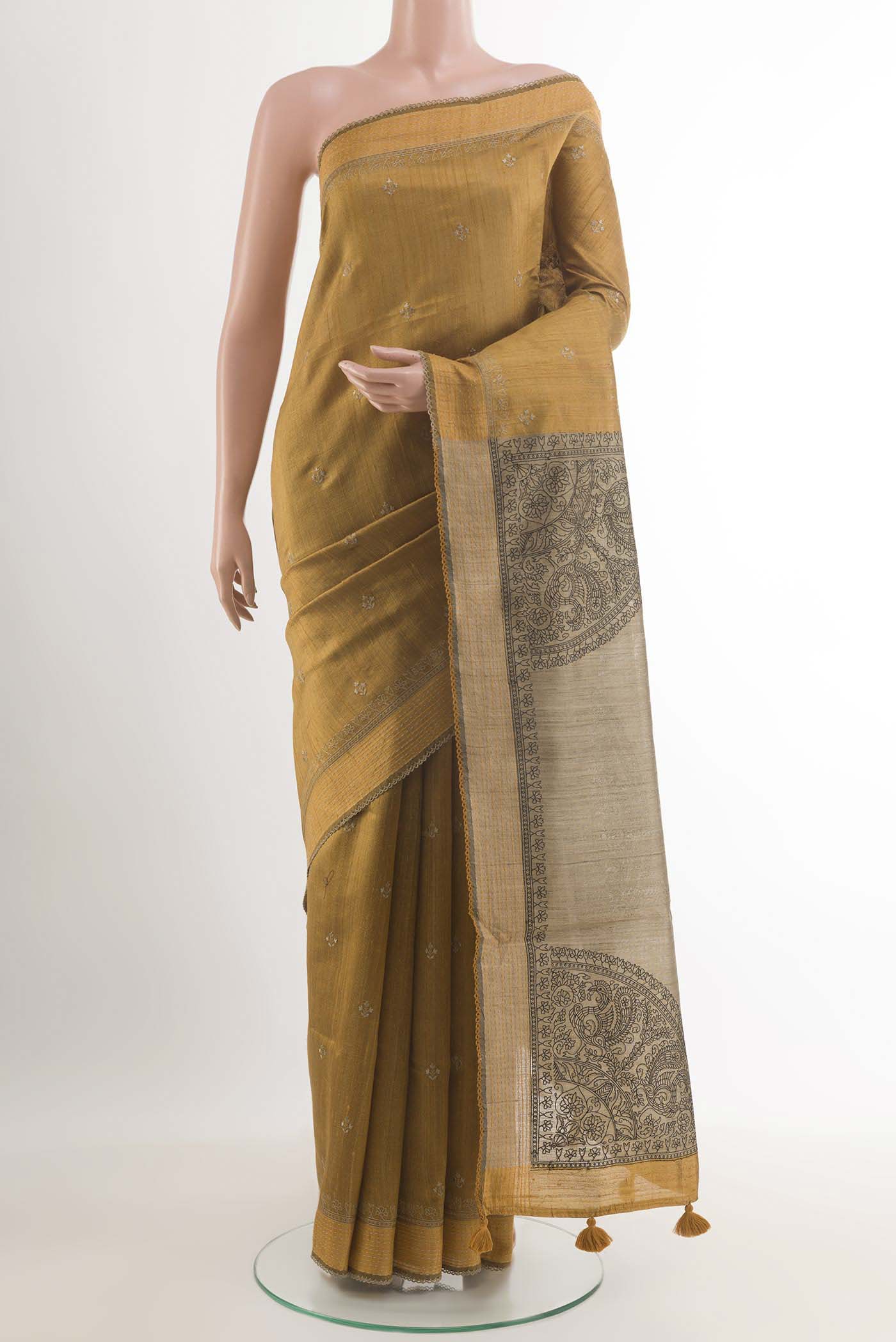 Mustard Dual Tone Tussar Saree with Thread Butta on the body and Temple Border.  displayed on a mannequin
