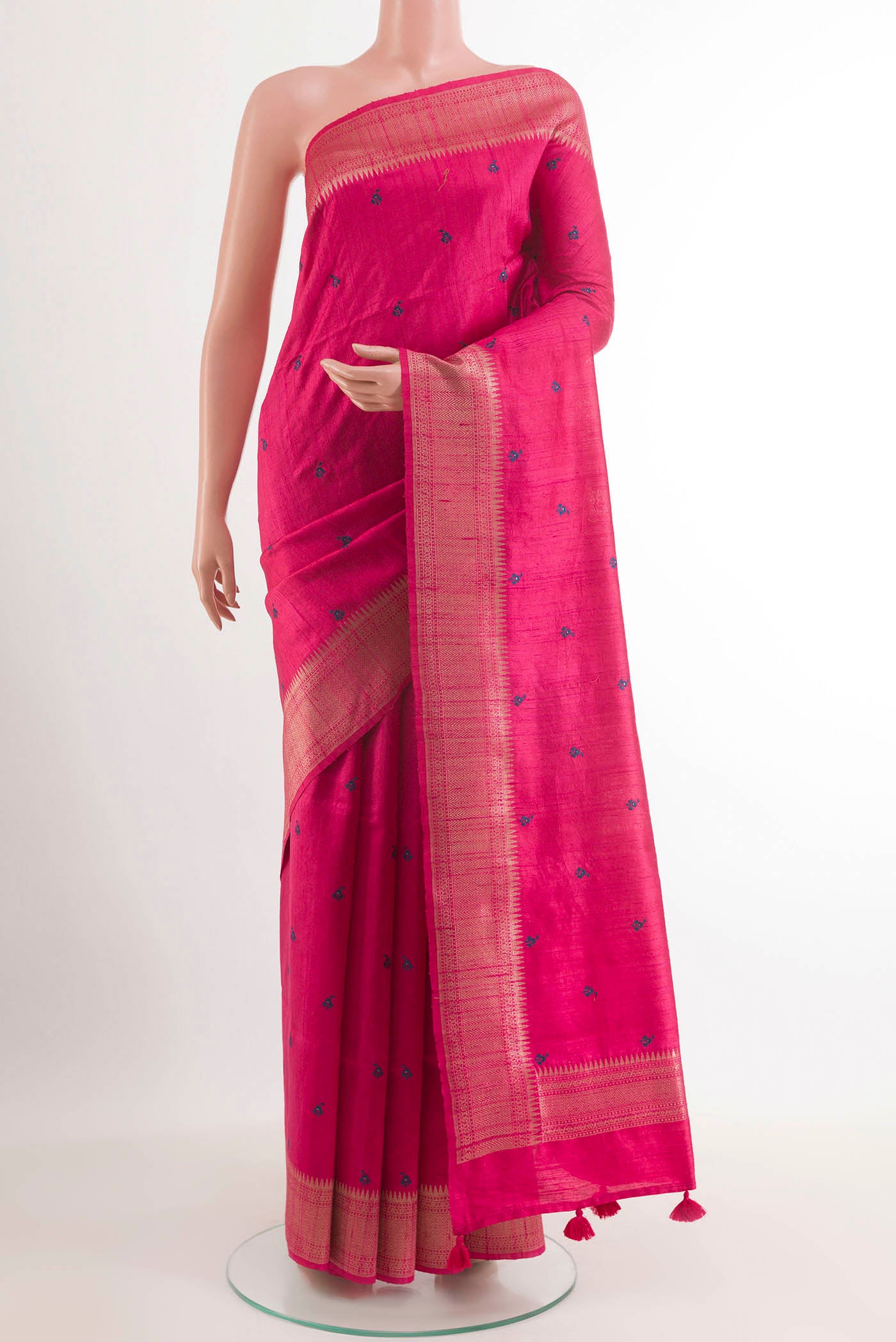 Pink Tussar Saree with Thread Butta on the body and Zari Border.  displayed on a mannequin