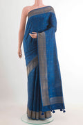 Blue Tussar Saree with Thread Butta on the body and Zari Border.  displayed on a mannequin