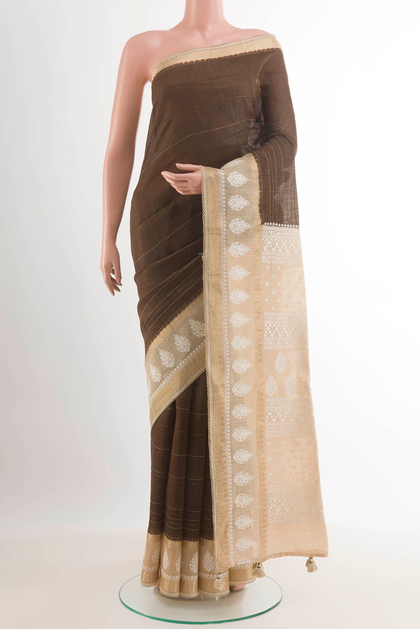Brown Tussar Saree with Stripes on the body and Embroidery Border.  displayed on a mannequin