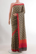 Blue Printed Silk Saree with Printed design on the body and Printed Border.  displayed on a mannequin