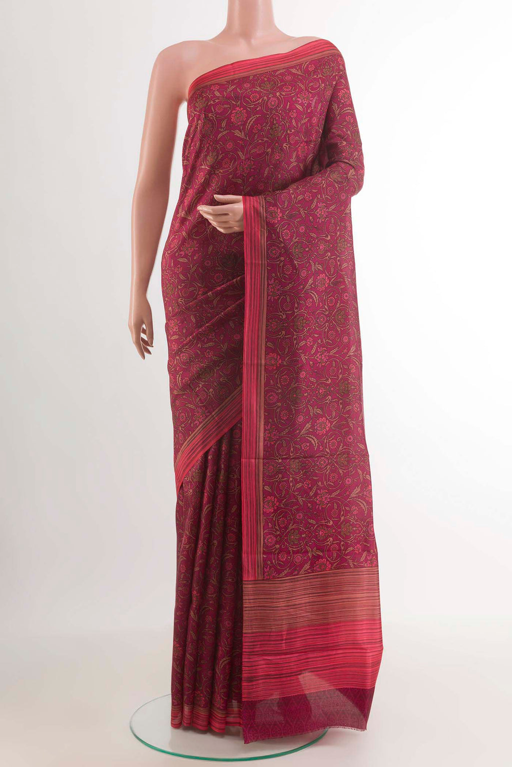 Purple Printed Silk Saree with Printed design on the body and Plain Border.  displayed on a mannequin