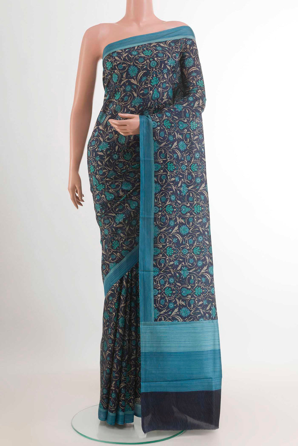 Dark Blue Printed Silk Saree with Printed design on the body and Printed Border.  displayed on a mannequin