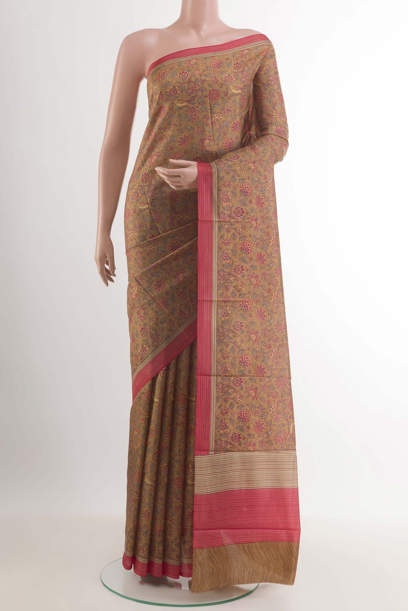 Beige Printed Silk Saree with Printed design on the body and Plain Border.  displayed on a mannequin