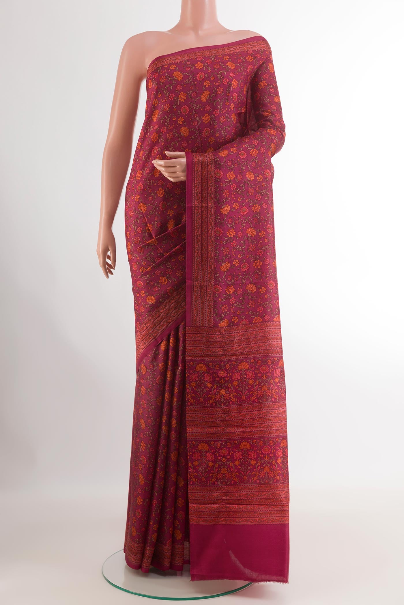 Magenta Printed Silk Saree with Printed design on the body and Printed Border.  displayed on a mannequin