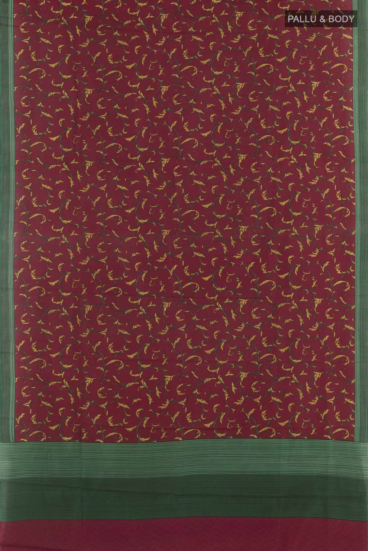 Flat view of Maroon Printed Silk Saree with Printed design on the body and Printed Border. 