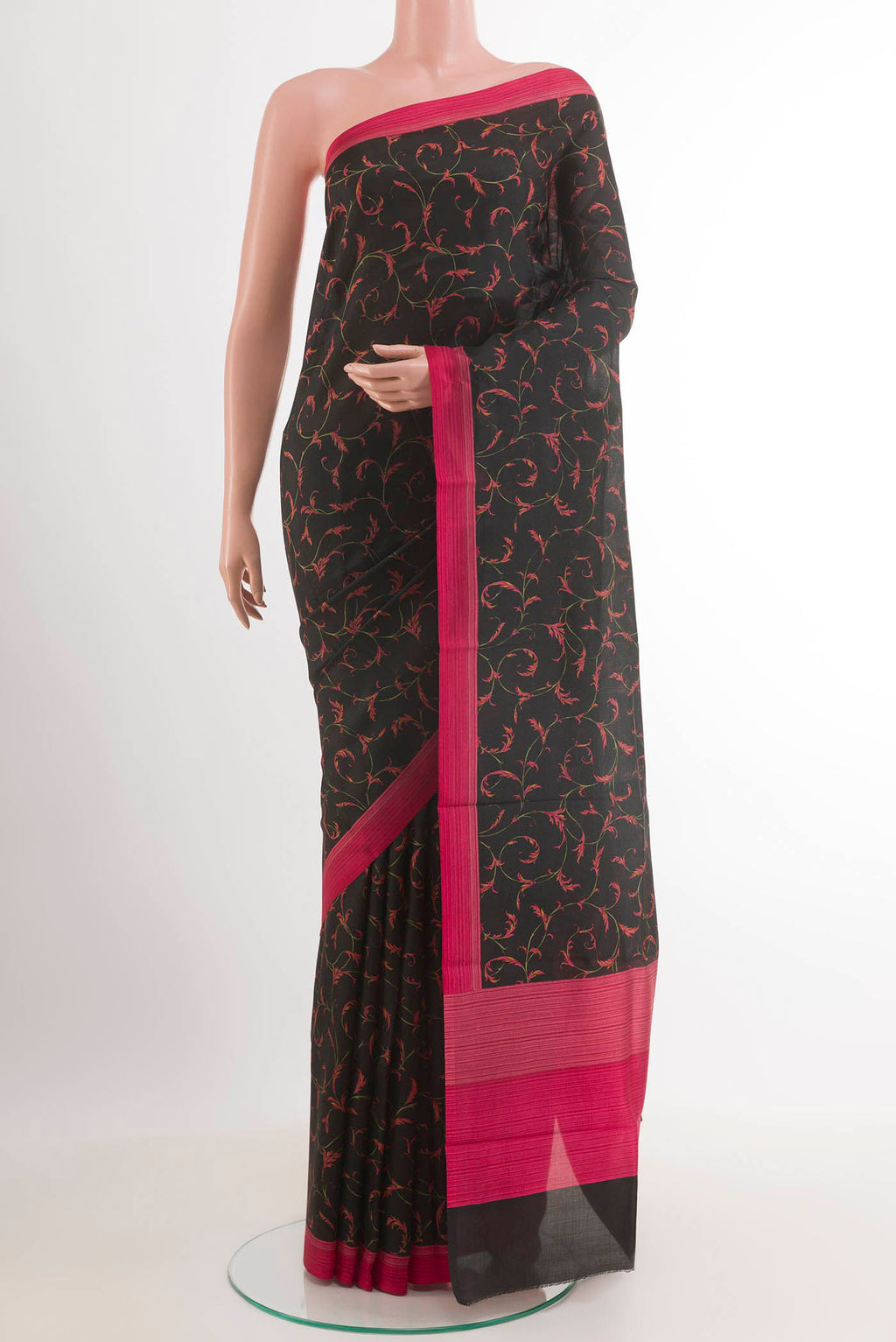Black Printed Silk Saree with Printed design on the body and Printed Border.  displayed on a mannequin