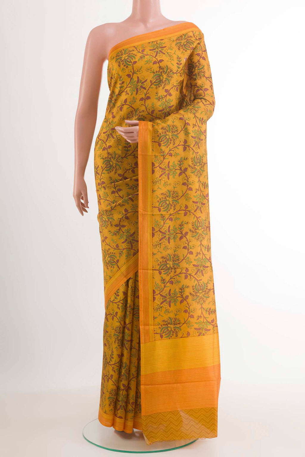 Yellow Printed Silk Saree with Printed design on the body and Printed Border.  displayed on a mannequin