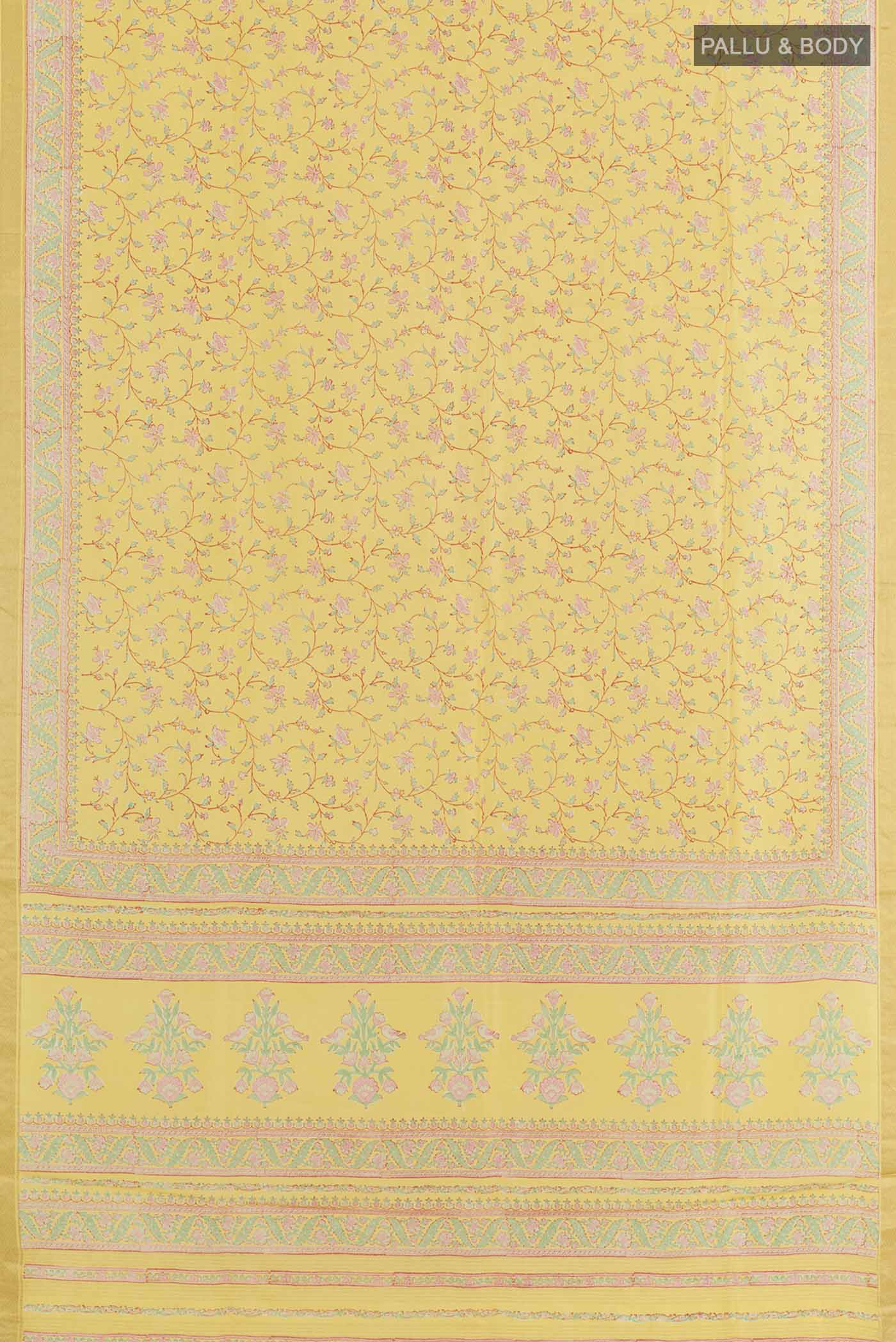 Flat view of Yellow Printed Silk Saree with Printed design on the body and Zari Border. 