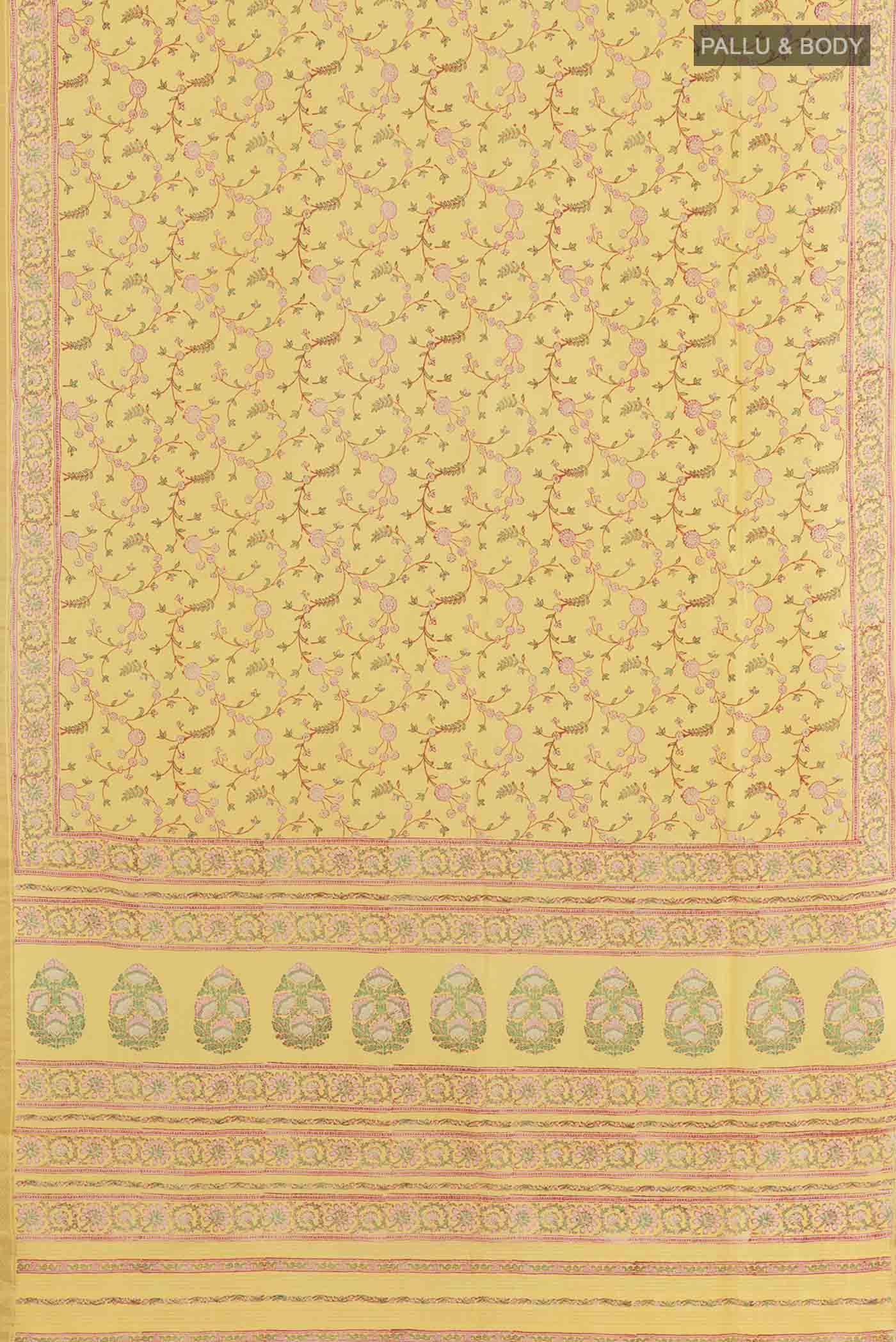 Flat view of Yellow Printed Silk Saree with Printed design on the body and Zari Border. 