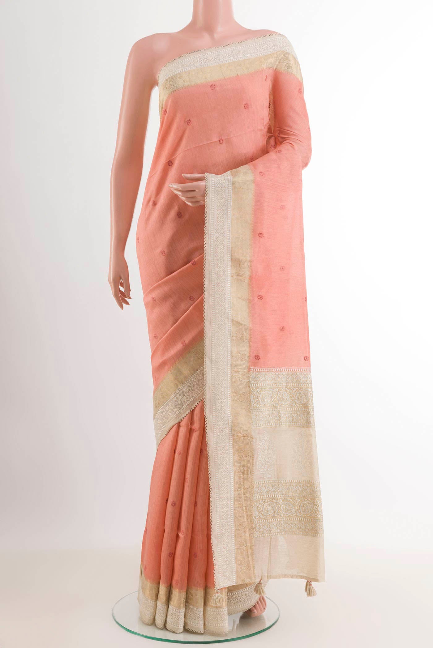 Rose pink Tussar Saree with Thread Butta on the body and Thread Border.  displayed on a mannequin