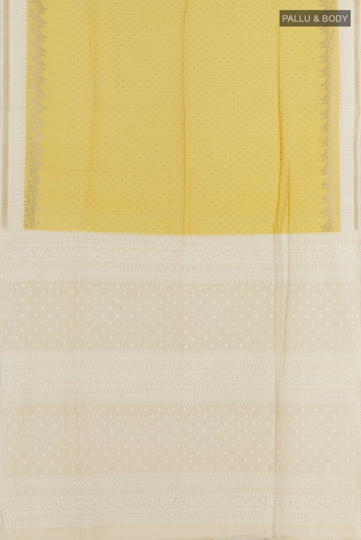 Flat view of Yellow Tussar Saree with Zari Butta on the body and Zari Border. 