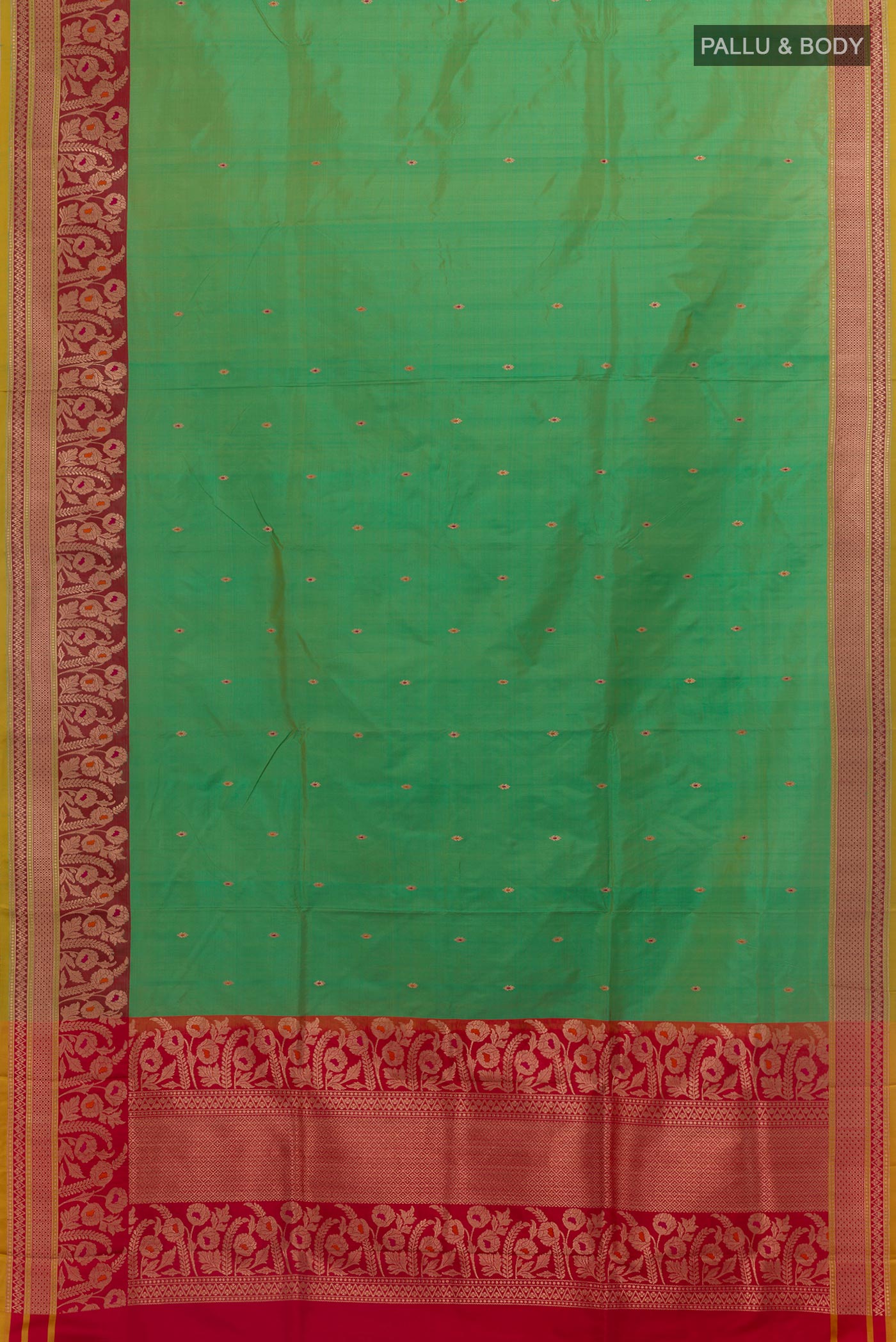 Flat view of Green Banarasi Katan Silk Saree with Zari Butta on the body and Zari Border. 