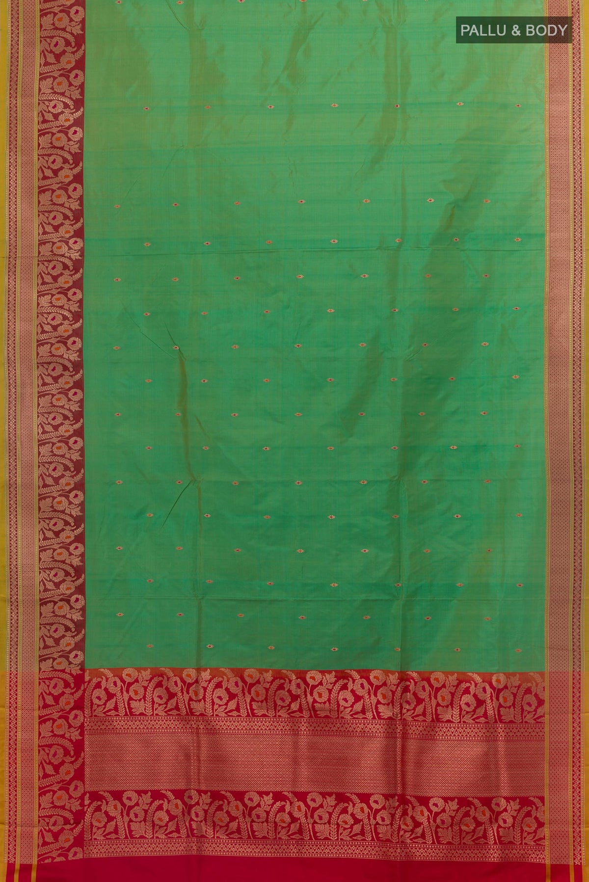 Flat view of Green Banarasi Katan Silk Saree with Zari Butta on the body and Zari Border. 