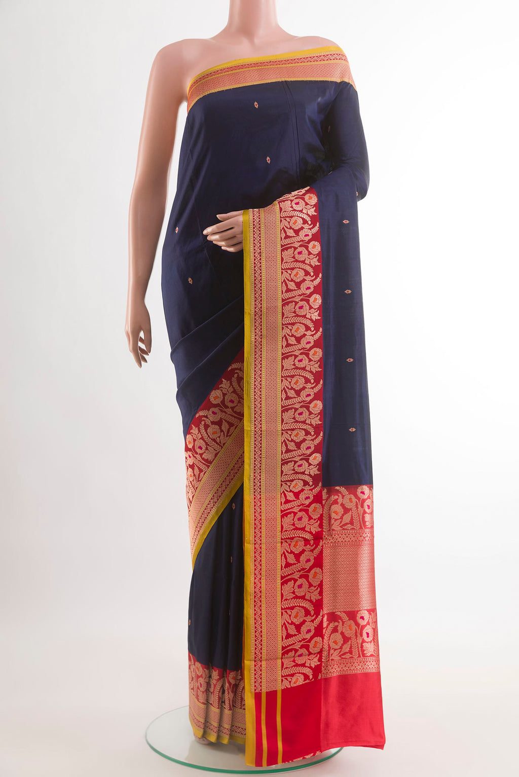 Navy Blue Banarasi Katan Silk Saree with Zari Butta on the body and Zari Border.  displayed on a mannequin
