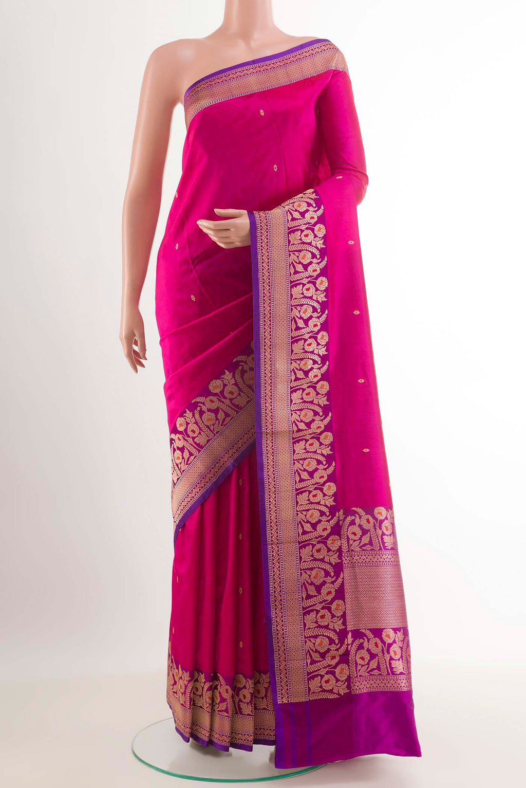 Rani Pink Banarasi Katan Silk Saree with Zari Butta on the body and Zari Border.  displayed on a mannequin