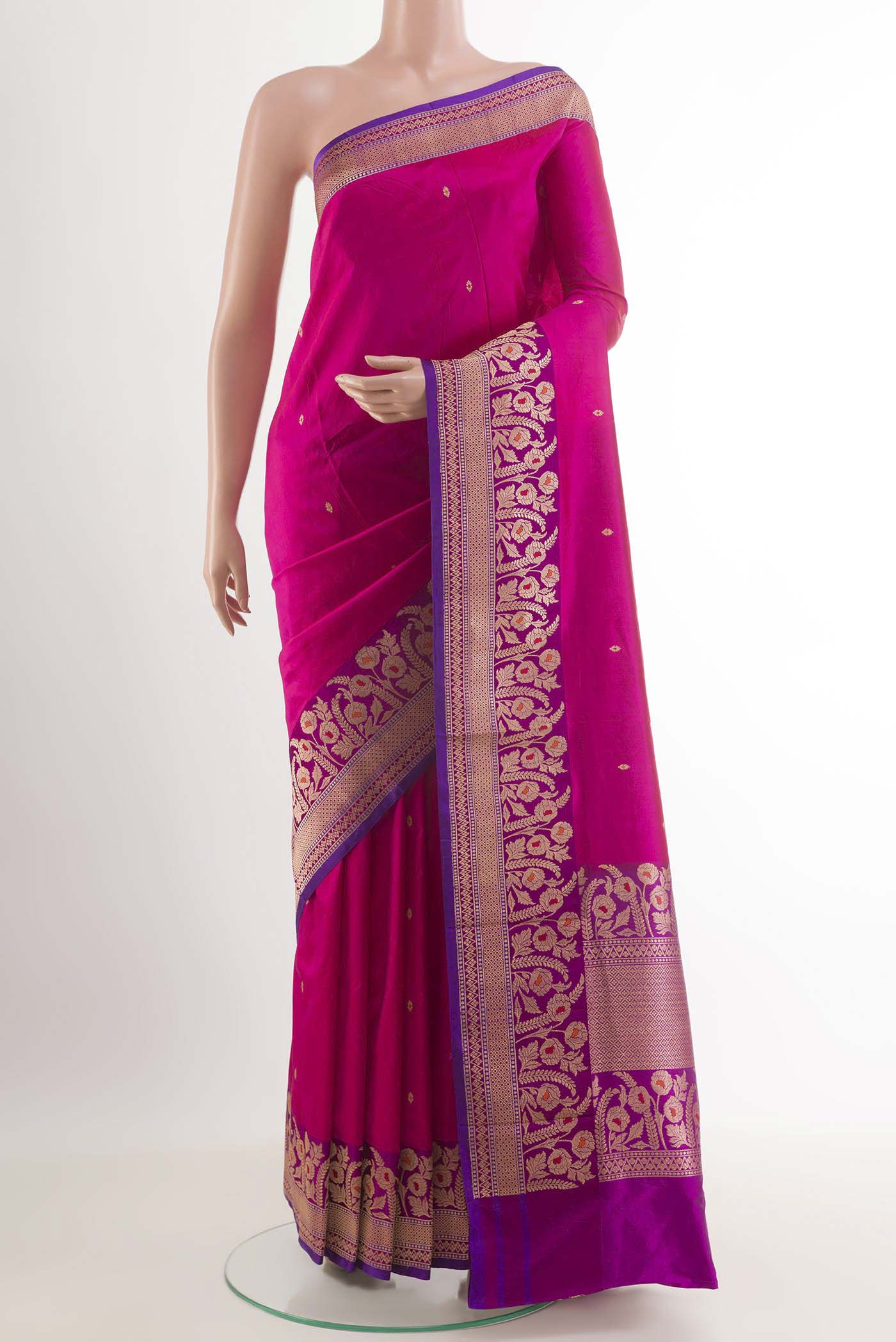 Rani Pink Banarasi Katan Silk Saree with Zari Butta on the body and Zari Border.  displayed on a mannequin