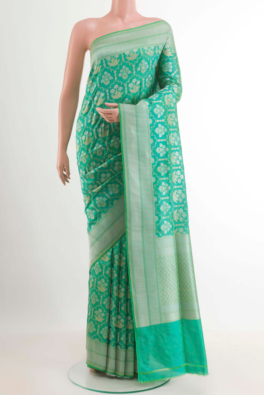 Sea Green Banarasi Silk Saree with Zari Brocade on the body and Zari Border.  displayed on a mannequin