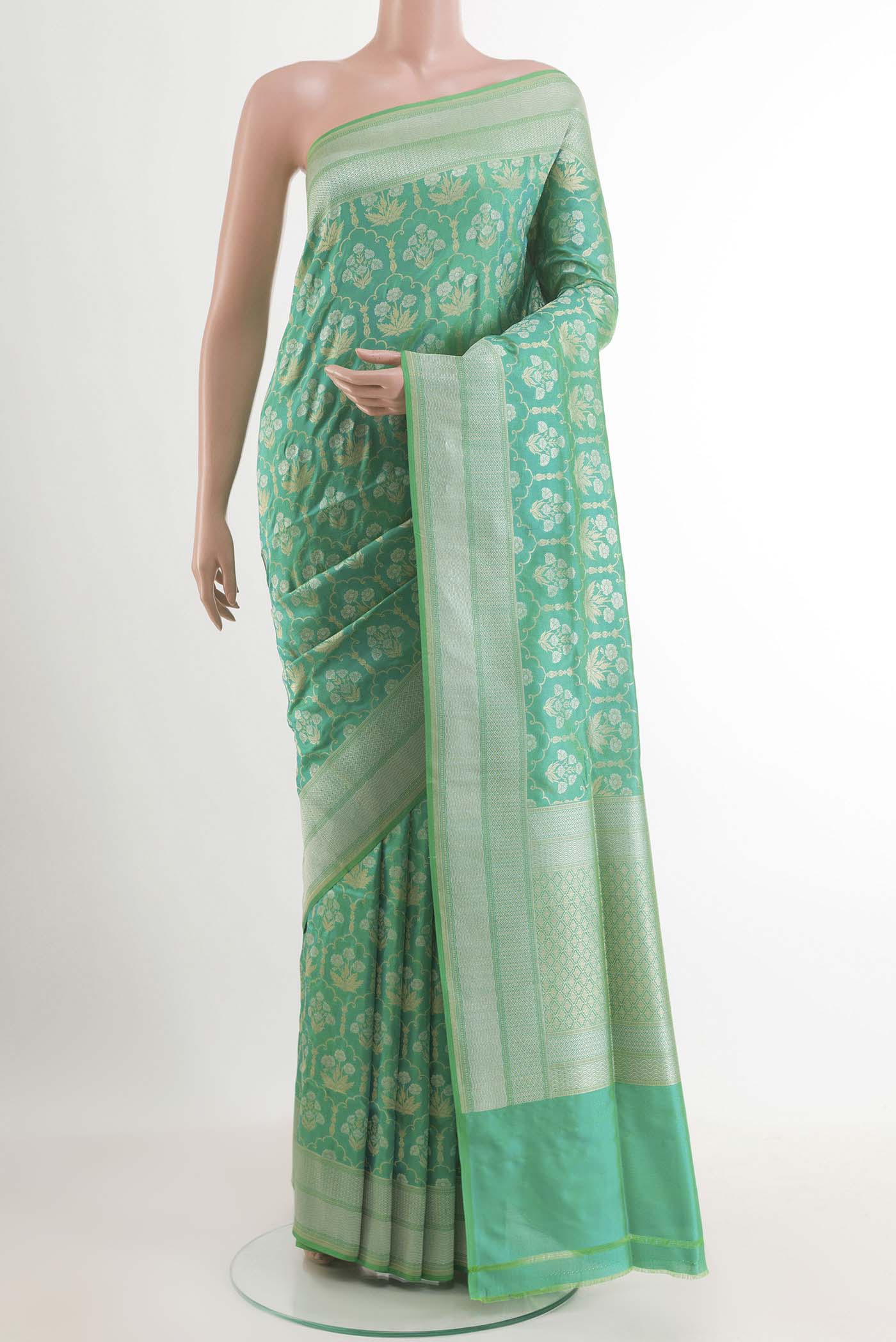 Sea Green Banarasi Silk Saree with Zari Brocade on the body and Zari Border.  displayed on a mannequin