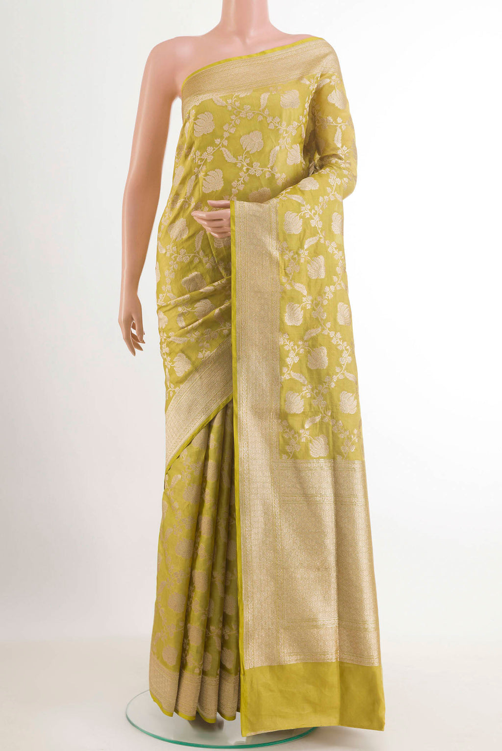 Green Banarasi Silk Saree with Zari Brocade on the body and Zari Border.  displayed on a mannequin