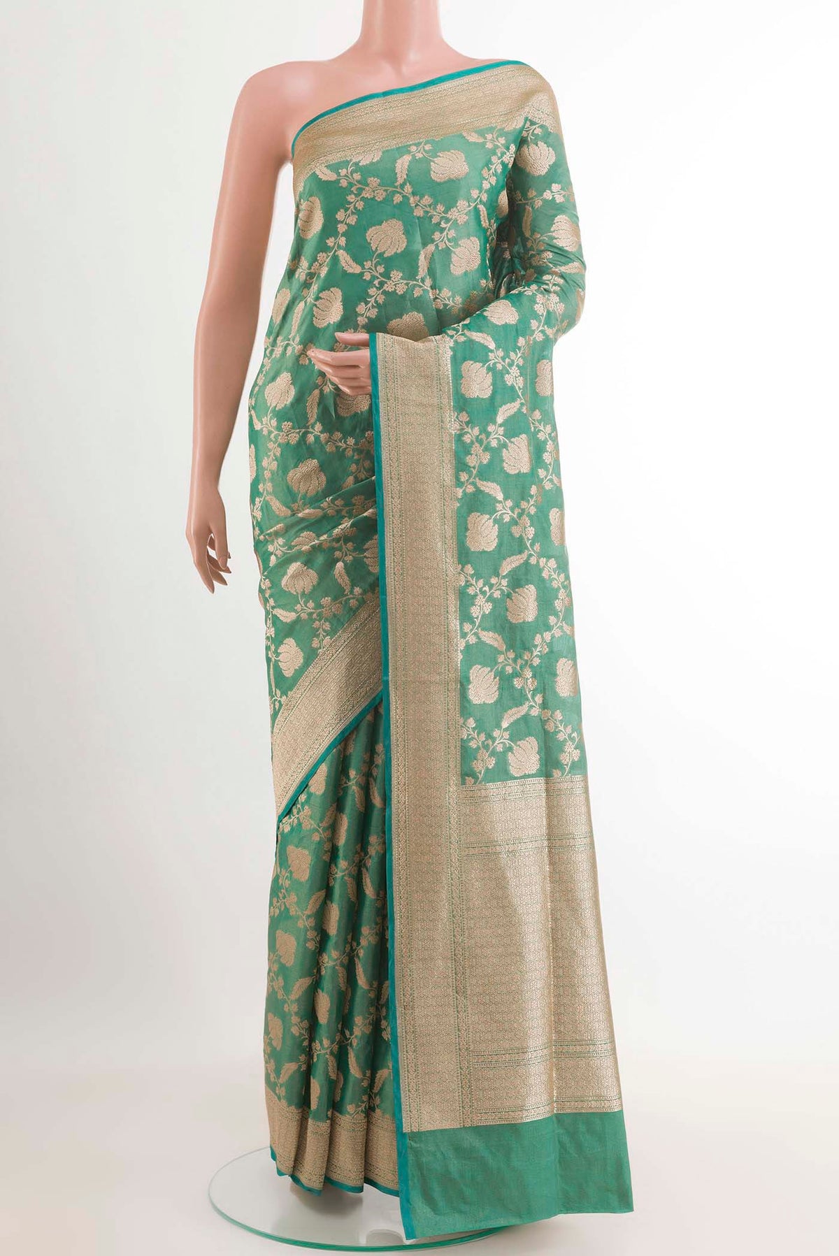 Sea Green Banarasi Silk Saree with Zari Brocade on the body and Zari Border.  displayed on a mannequin